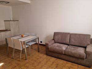 a living room with a couch and a table at DA ARTU' in Udine +5 photos