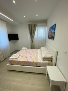 Letto o letti in una camera di B&B San Luca