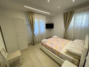 Letto o letti in una camera di B&B San Luca