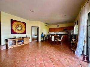 a large room with a kitchen and a dining room at Seabreeze Residence 145 in Ban Tha Fat