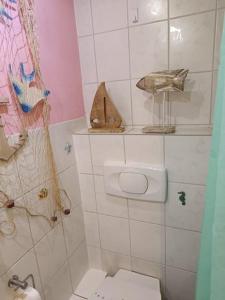 a small bathroom with a toilet and a sink at Haus Luise in Stapelburg +45 photos