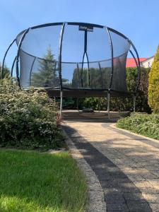 a swing set in a park at Villa Aida in Mielno