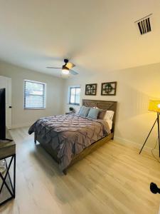 a bedroom with a bed and a ceiling fan at Retreat near Kaseya Center Calle Ocho Downtown Miami Beaches in Miami