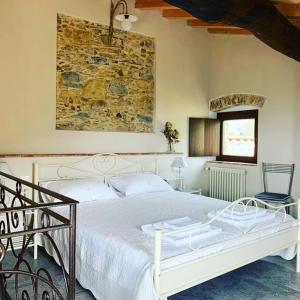 Un pat sau paturi într-o cameră la Casa Dell'Angelo