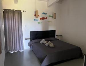 a bedroom with a bed with two towels on it at Affitto frassanito in Otranto +83 photos