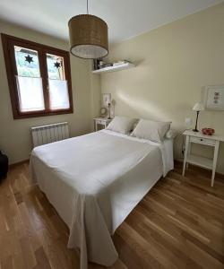 Postel nebo postele na pokoji v ubytování Sallent de Gállego - Formigal - Pirineos Sur