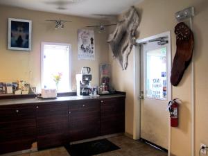 a kitchen with a counter and a window and a door at Merrill Field Inn in Anchorage