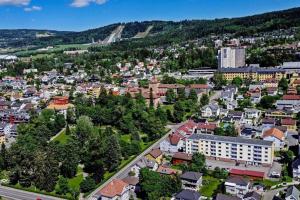 an aerial view of a city with buildings at Beautiful apartment in the middle of Lillehammer. in Lillehammer