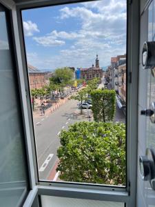 a view from a window of a city street at City Pension in Rastatt