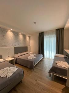 Postel nebo postele na pokoji v ubytování Hotel Aldebaran