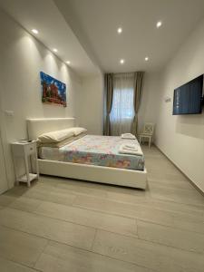 Letto o letti in una camera di B&B San Luca