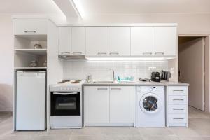 Kuchyň nebo kuchyňský kout v ubytování Aroma Accommodations