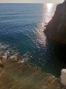 a view of the ocean from a cliff at Apparamento Raysol in Agnone Bagni