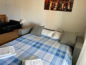 Postel nebo postele na pokoji v ubytování CAPRI-TURIS Luxe Apartamentos