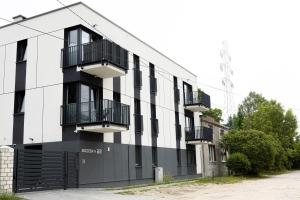 an apartment building with black and white at Brzeska 22 in Łódź