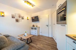 a living room with a couch and a table at Riedbach-Lodge 2 in Viechtach