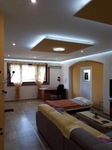 a living room with a couch and a table at APARTMAN ROSEMARY in Rijeka