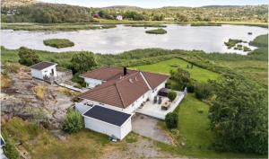 an aerial view of a house with a lake at Villa Bernhardina in Grebbestad