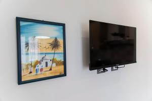 TV a/nebo společenská místnost v ubytování Appartamento Torregalli, confortevole e moderno