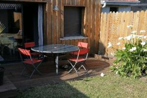 a table and four chairs on a patio at Océane in Gujan-Mestras