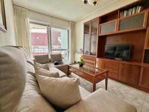 a living room with a couch and a tv at Isla Mar - 5833 in Isla