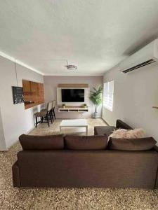 a living room with a couch and a table at Villa Orquidea 1 in Humacao