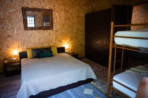 a bedroom with two bunk beds in a room at Quinta da Mal-disposta, cabin lodge Countryhouse in Resende