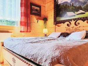 Posteľ alebo postele v izbe v ubytovaní Domek Góralski Stary Młyn Zakopane House