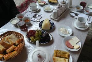 a table with a bunch of food on it at Mumtoz Plaza in Bukhara