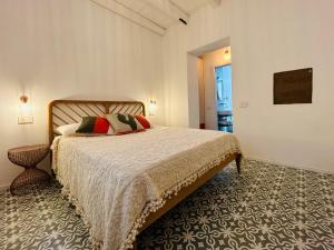 מיטה או מיטות בחדר ב-Palazzo Ma.Ri.Lu.