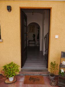 an open door of a house with a hallway at Ferienwohnung Waldschloss in Eppenbrunn