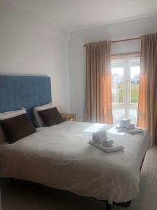Ένα ή περισσότερα κρεβάτια σε δωμάτιο στο White Beach House