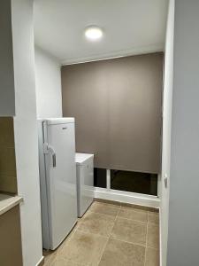 Η κουζίνα ή μικρή κουζίνα στο Alex Apartment