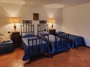 Katil atau katil-katil dalam bilik di L'antica loggia