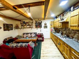 a living room with a couch and a table and chairs at Villa Nors in Yerevan