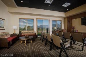 a living room with a couch and a table and chairs at Stoneridge Resort in Blanchard