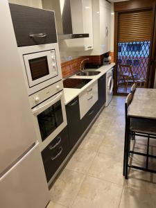 A kitchen or kitchenette at AVA-2