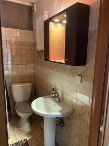 a bathroom with a sink and a toilet at George Garden in Nea Michaniona +11 photos