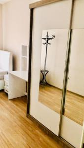 a mirror in a room with a cross on the wall at Full 2 bedroom apartment in luxury complex in Esenyurt