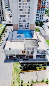 a building with a swimming pool on top of it at Full 2 bedroom apartment in luxury complex in Esenyurt