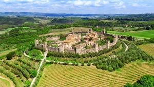 an aerial view of a castle in a vineyard at Casa Giusti in Poggibonsi