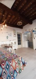 a bedroom with a bed and a table in a room at Casina del castello in Castelnuovo della Misericordia +27 photos