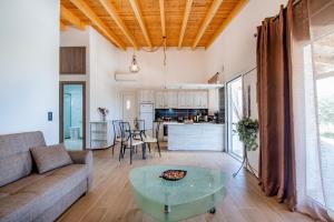 a living room with a couch and a table at George's Paradise in Afantou