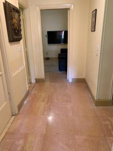 A television and/or entertainment centre at Prime location 2 bed rooms Apartment , near the Nile & Cairo Center