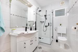 a bathroom with a shower and a sink and a toilet at Villa Marica, Premium residence, Krk in Krk