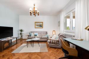 a living room with a couch and a tv at Villa Marica, Premium residence, Krk in Krk