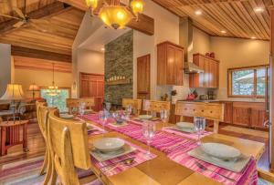 a kitchen and dining room with a table and chairs at Tan Oak - Unit 37 in Sunriver