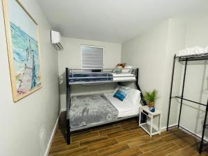 a small bedroom with a bunk bed in it at Home for your stay in Humacao