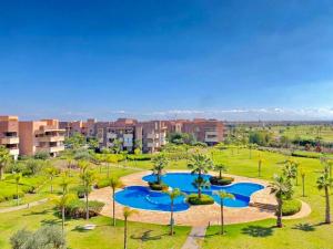 an aerial view of a park with palm trees at Préstigia Agate 258 in Marrakesh