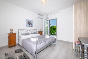 Postel nebo postele na pokoji v ubytování Villa Mediterana